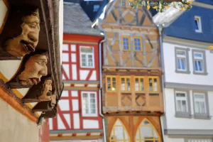 Timbered framed and medieval traditional houses in the medieval town Limburg an der Lahn, Hesse, Germany, Europe, with details of woodcarving at House Bruckengasse 9 (built in 16 century)